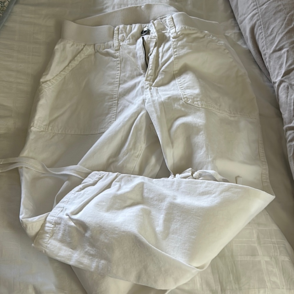 Capri pants with styling string on bottom.
